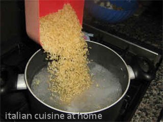 adding rice to water