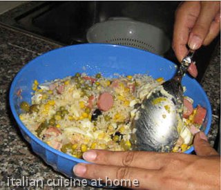stirring rice salad